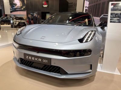 Front close-up of a vehicle with sleek LED headlights and aerodynamic design