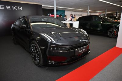 Front view of sleek electric sedan with aerodynamic design and LED headlights