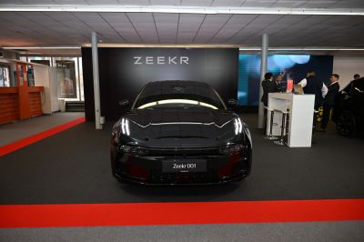 Front view featuring sleek LED headlights and aerodynamic hood design.