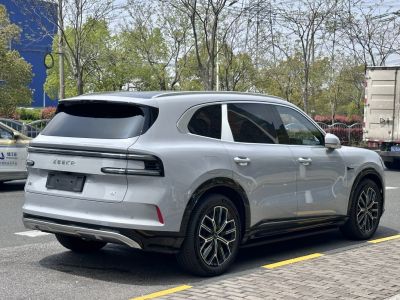 Side and rear profile of a modern electric SUV with distinctive taillights