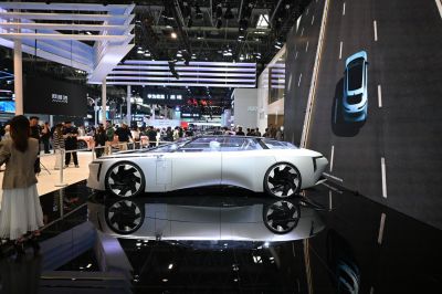 Futuristic electric sedan with panoramic glass roof and large wheels