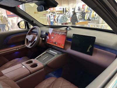 Dual large touchscreen displays and brown leather interior