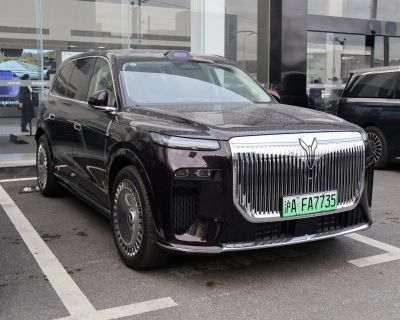 Large vertical chrome grille and sleek LED headlights on SUV front