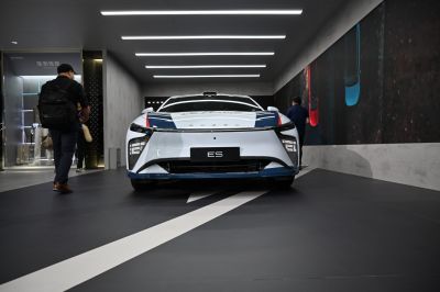 Sleek front view with distinctive LED headlights and aerodynamic design