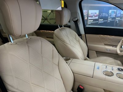 Beige quilted perforated leather seats with modern center console