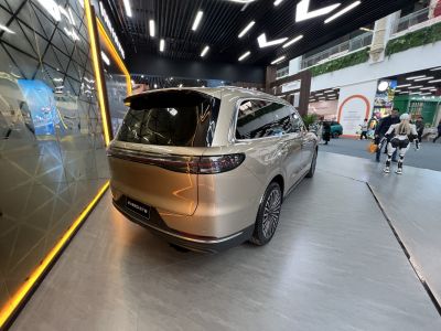 Sleek SUV rear design with taillights and multi-spoke alloy wheels
