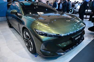 Close-up front view featuring sleek LED headlights and alloy wheels.