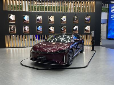 Sleek front view of a maroon SUV with modern design elements