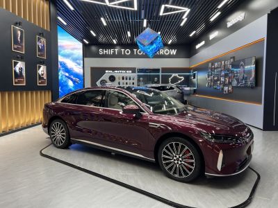 Sleek electric luxury sedan with alloy wheels and spacious interior