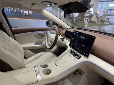 Luxury beige leather seats and modern digital touchscreen dashboard