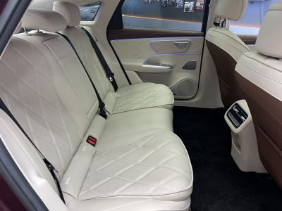 Quilted cream leather rear seats with ambient lighting and rear air vents.
