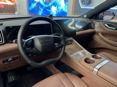 Modern steering wheel with dual digital displays in luxury car interior