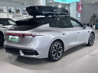 Silver hatchback with roof box and unique alloy wheels