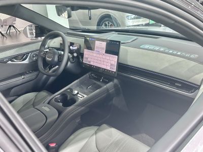 Modern car interior with large central touchscreen and digital driver display