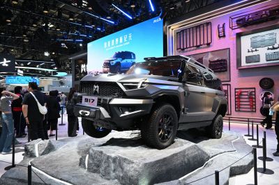 Bold angular SUV design on rugged display terrain