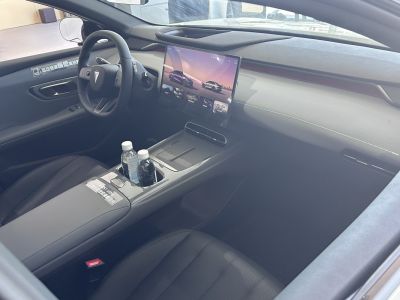 Modern car interior with large central touchscreen and minimalistic dashboard