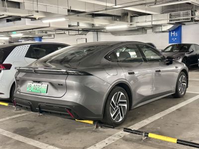 Sleek sedan rear with integrated LED tail light, aerodynamic curves