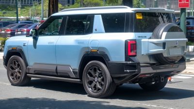 Rear side view of SUV with spare tire mounted on door