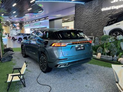 Rear of electric SUV with LED light bar and charging port