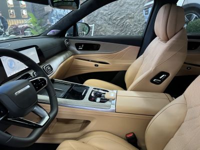Beige leather seats and modern touchscreen dashboard interior