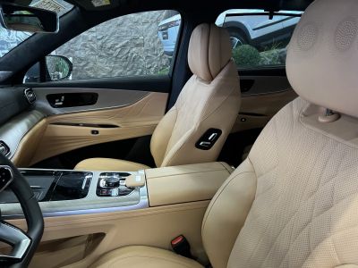 Premium beige leather seats and modern center console in car interior