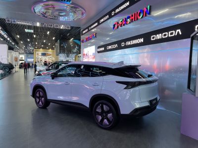 Rear and side view of sleek modern SUV with tinted windows and black trim