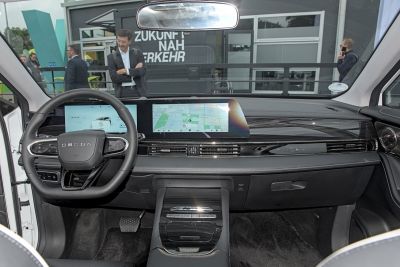 Steering wheel and dual digital screens on modern dashboard