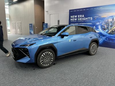 Sharp angular front with LED headlights and aerodynamic side profile in blue.