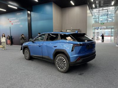 Angular blue crossover rear with distinct taillights and large wheels