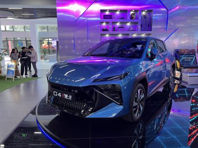 Futuristic SUV front with LED strip headlights and aggressive grille design.