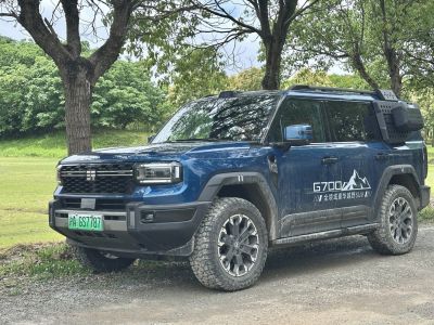 Rugged off-road SUV front side view with tires and side storage box