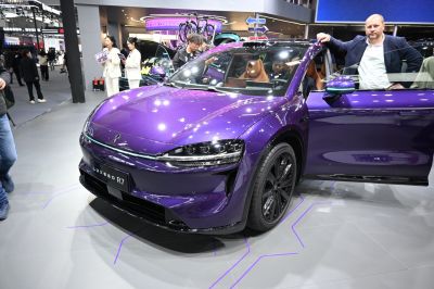 Sleek front fascia with LED headlights and aerodynamic design in purple finish.