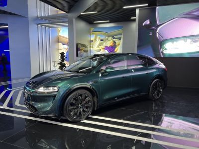 Sleek electric SUV with modern headlights and premium multi-spoke wheels