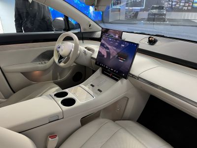 Modern car interior with large central touchscreen and digital driver display