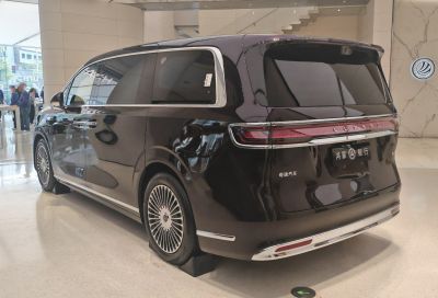 Sleek rear design with tinted windows and detailed alloy wheels.