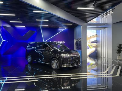 Luxury electric minivan with futuristic LED lighting and modern design