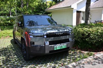 Front view of SUV with bold grille and sleek LED headlights