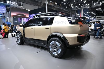 Futuristic SUV rear and side design with rugged tires and roof rails