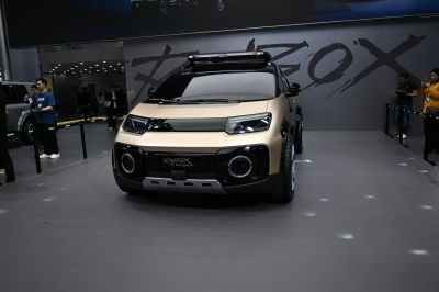 Futuristic SUV front with LED headlights and rugged design