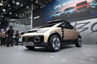 Futuristic SUV with geometric design and advanced headlights
