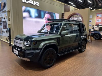 Rugged off-road SUV with roof rack and circular LED headlights