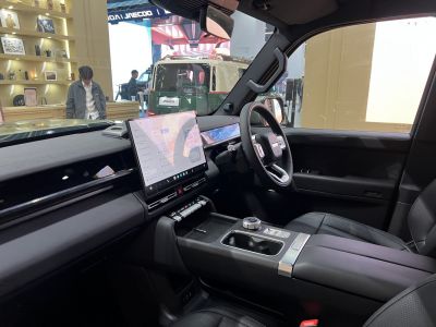 Modern car interior with large touchscreen dashboard and sleek steering wheel