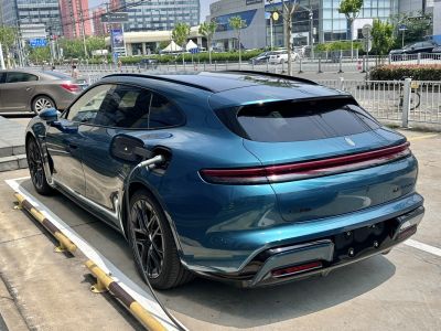 Electric vehicle charging with sleek rear and full-width taillight bar