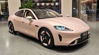 Sleek electric sedan with aerodynamic shape and LED headlights
