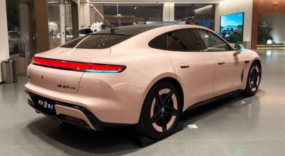 Rear and side profile of a sleek electric sedan with modern design.