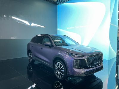 Modern SUV with large patterned grille and sleek LED headlights