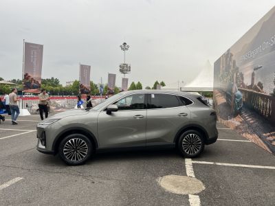 Side profile of a modern SUV with sleek body and alloy wheels