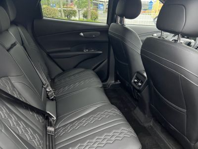 Black leather rear seats with decorative stitching and rear air vents
