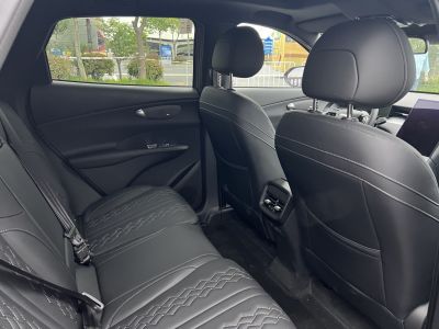 Rear black quilted leather seats with air vents and detailed stitching