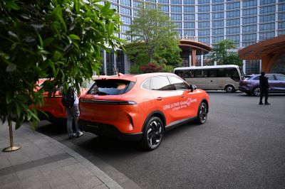 Rear view of modern compact SUV with LED taillights and sporty alloy wheels